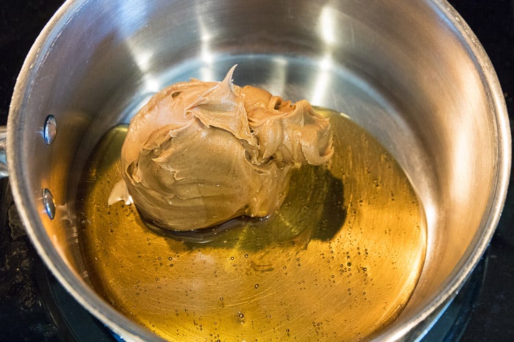 Peanut butter and honey in a saucepan.