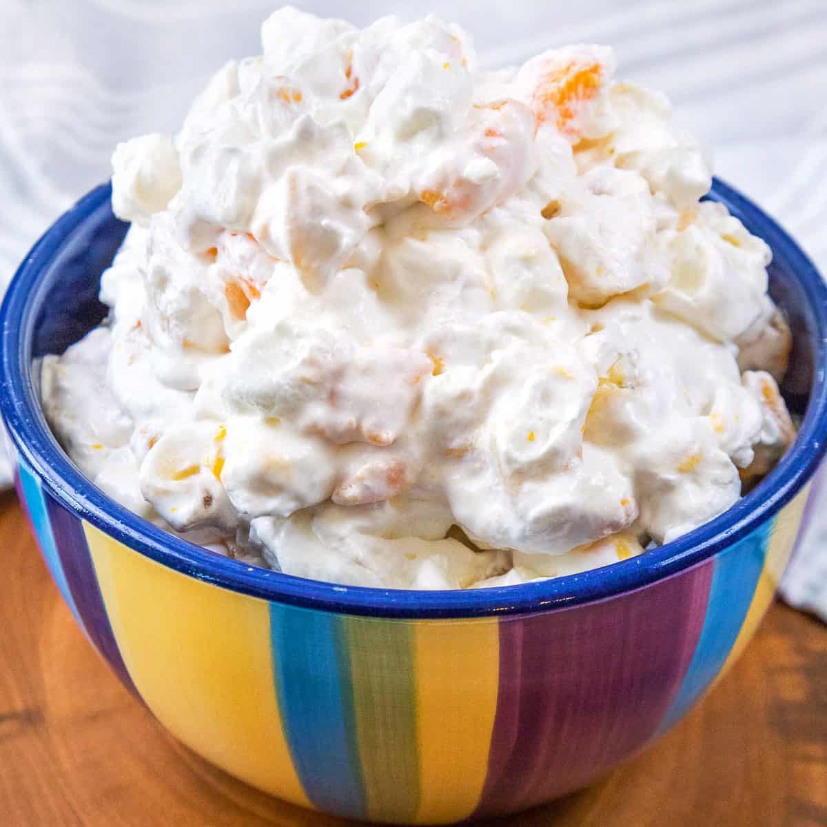 Old fashioned fruit salad with cool whip in a bowl.