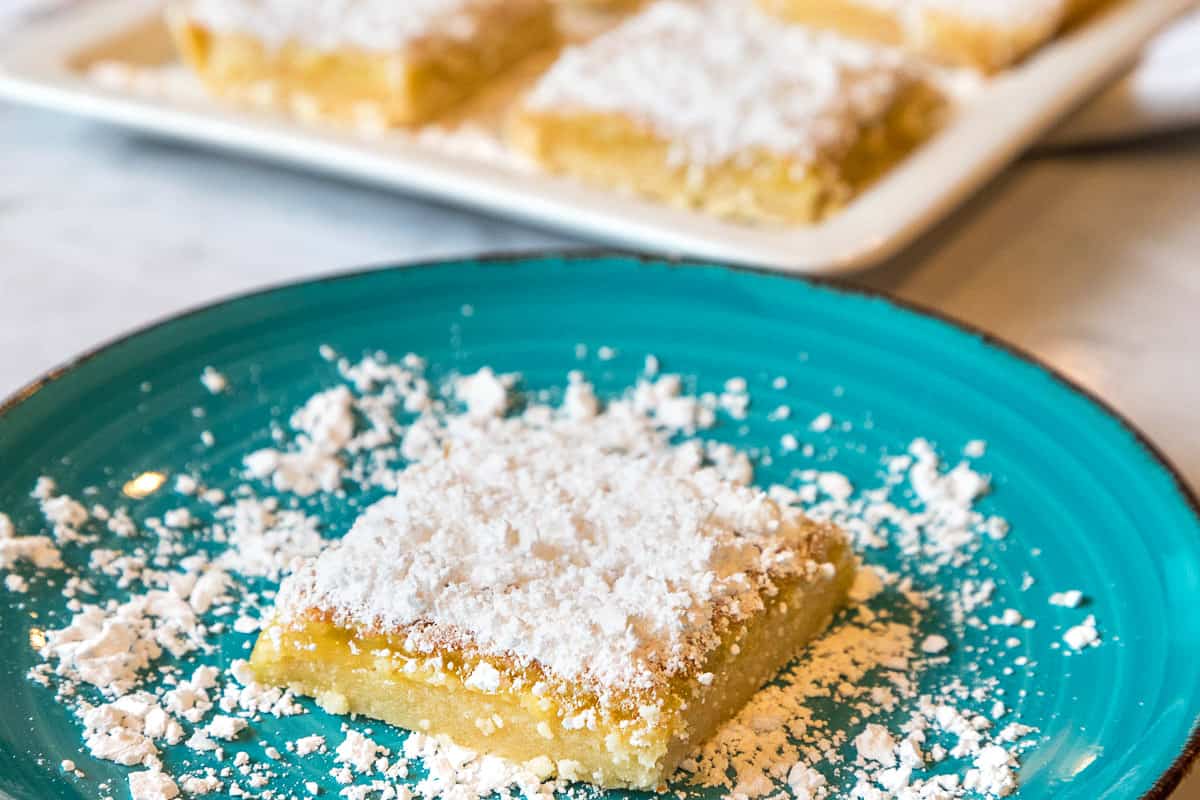 Old-fashioned lemon bar on a plate.