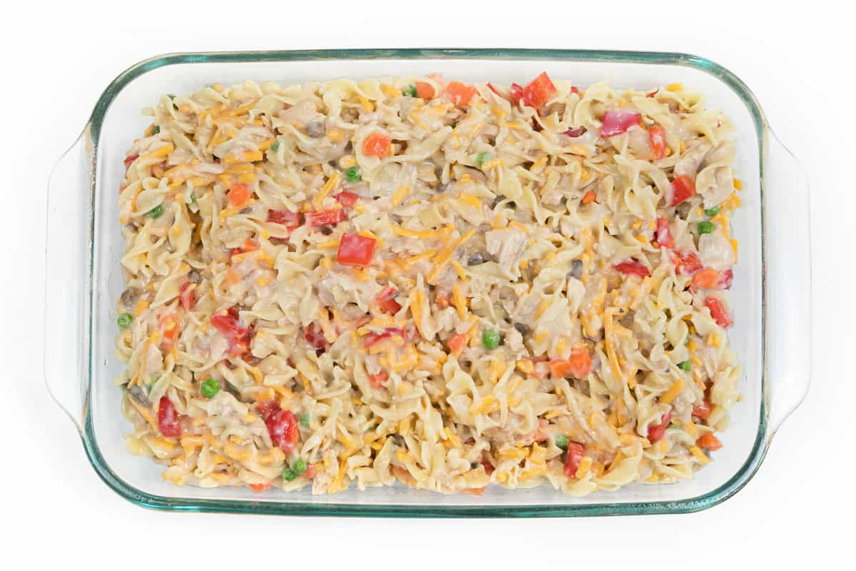 Put the tuna noodle casserole into a greased nine-by-thirteen-inch baking dish, then bake at three hundred and seventy-five degrees Fahrenheit for fifteen.