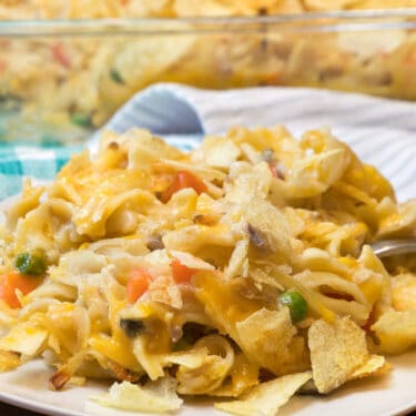 Old-fashioned tuna noodle casserole recipe on a white plate.