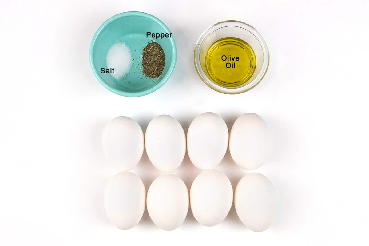 Ingredients for olive oil scrambled eggs without milk, eight large eggs, two tablespoons of olive oil, one-half teaspoon salt, and one-half teaspoon pepper.