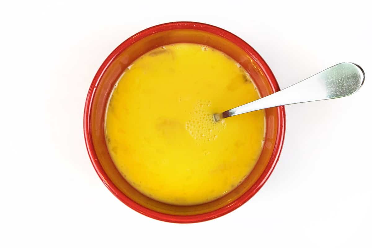 Beat eight eggs in a bowl.