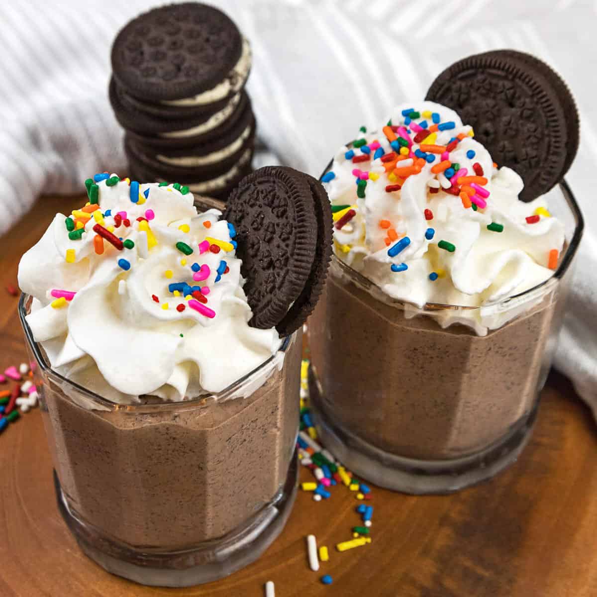 Oreo Chocolate milkshake with whipped cream and sprinkles.