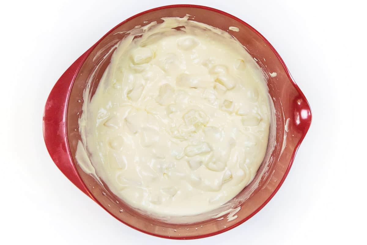 Mix the diced peaches with the eggs and cream cheese mixture until fluffy.