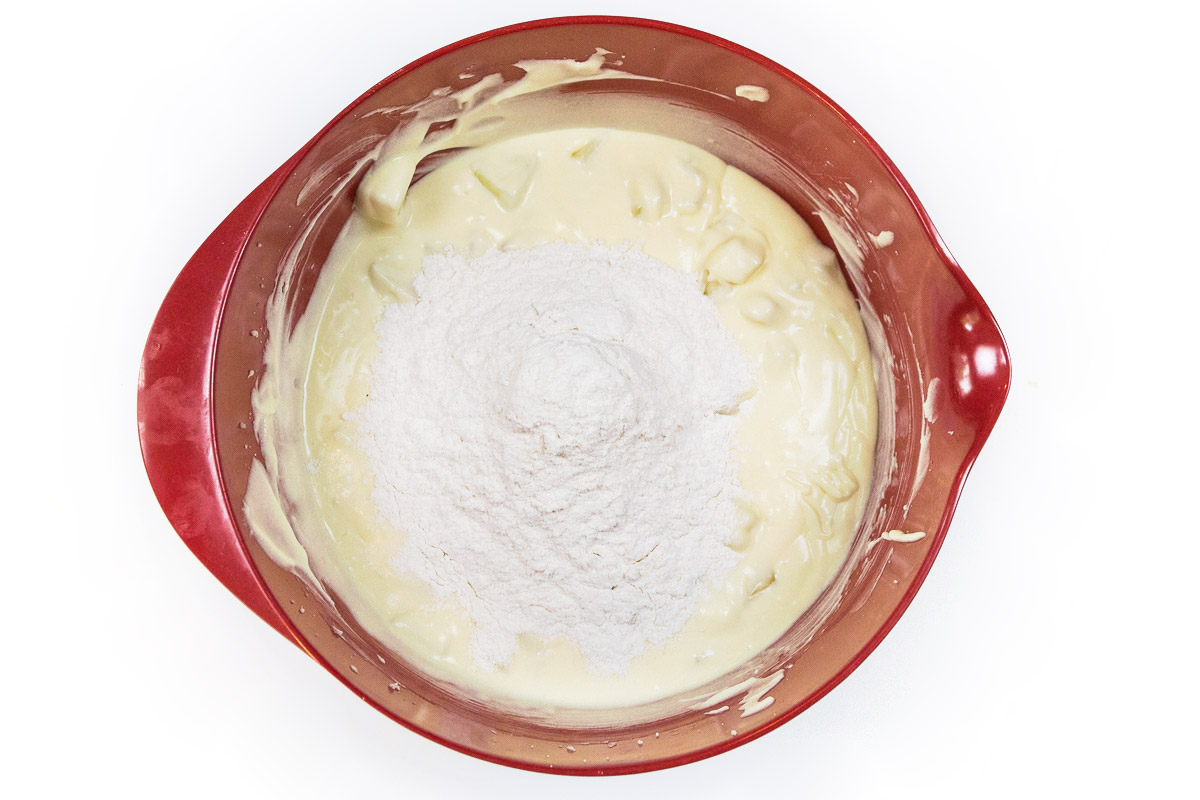 Add the flour mixture to the eggs and the cream cheese mixture.