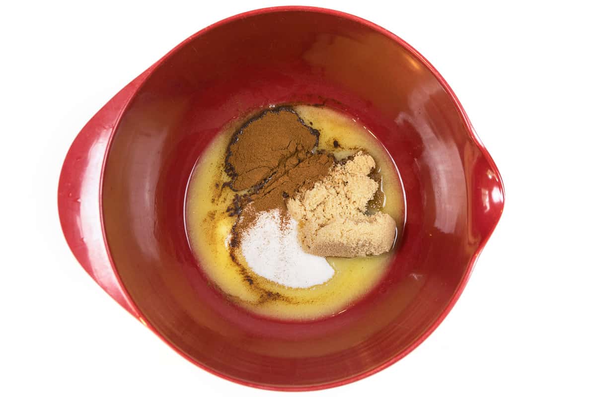 Add the melted butter to the granulated sugar, brown sugar, and cinnamon.