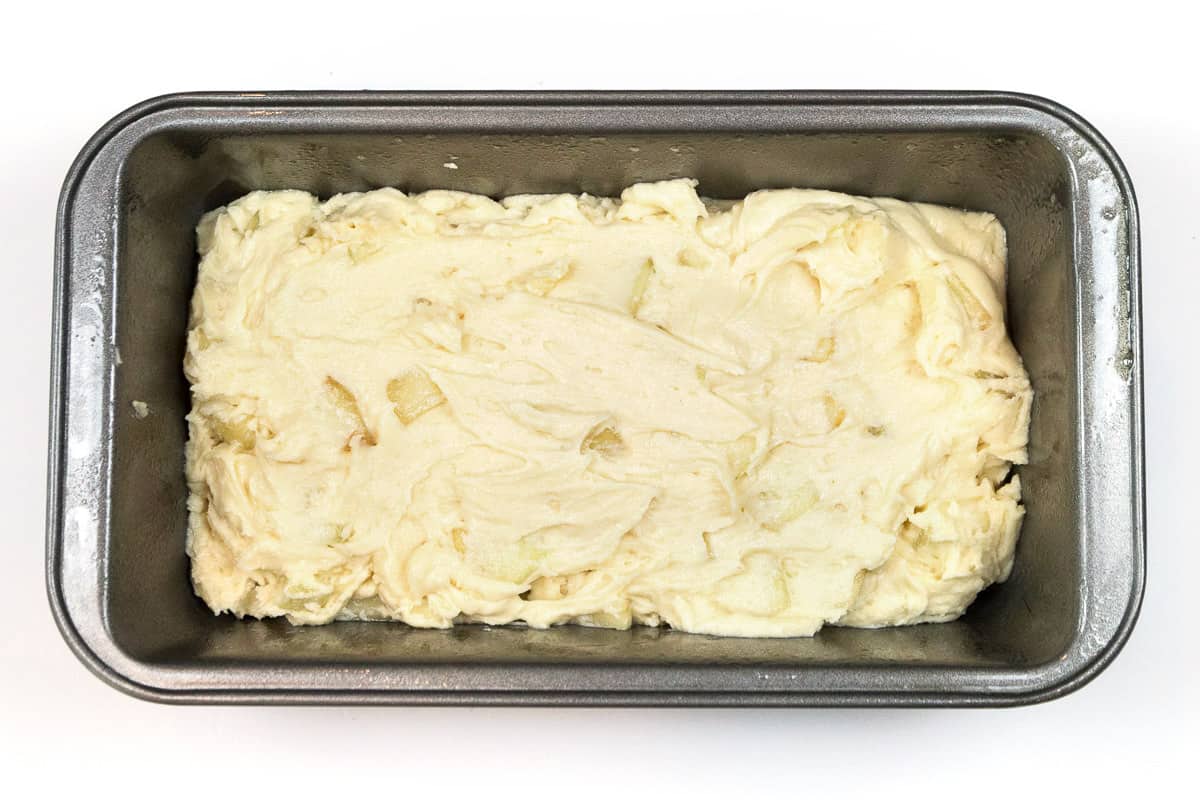 Peach bread recipe batter in a loaf pan before baking.
