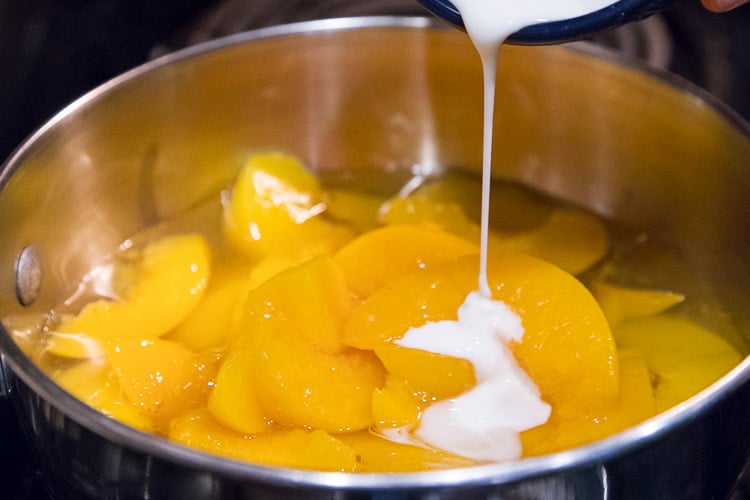 Add the cornstarch mixture to the peaches.
