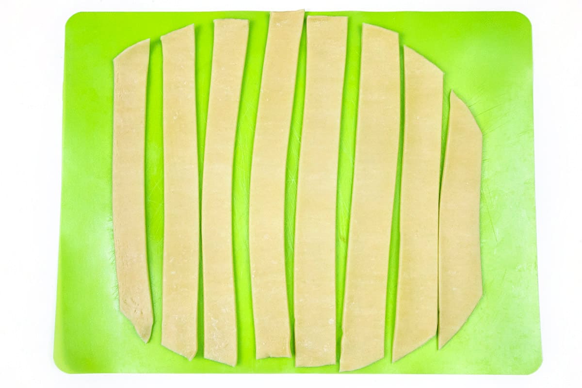 Cut eight strips of dough with the second pie crust.