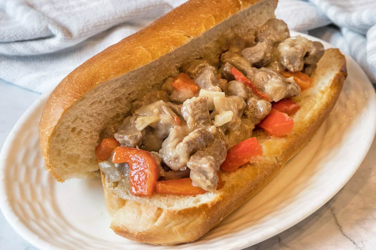 Put cheesesteak mixture into hoagie rolls.