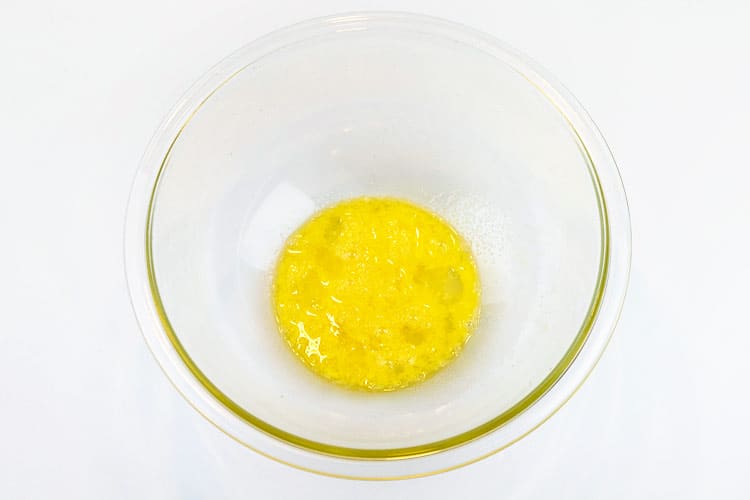 One beaten egg in a bowl.