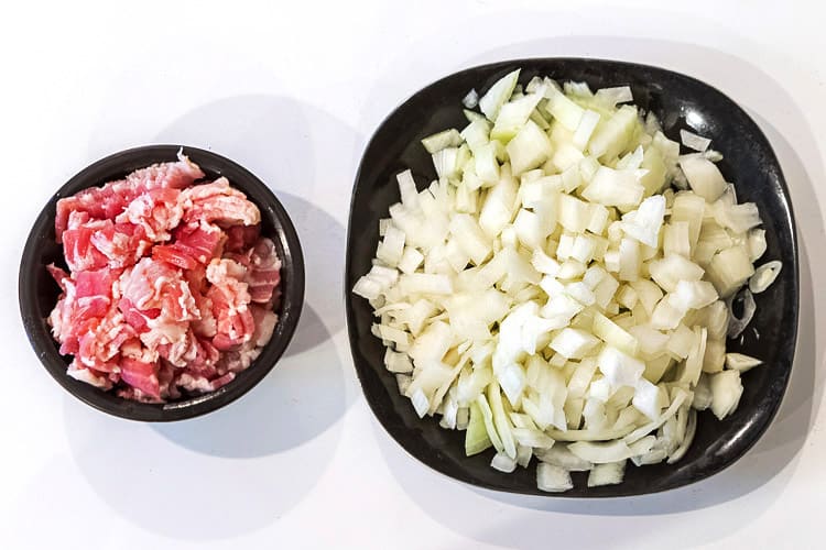 Chopped bacon and onions for potato dumplings.