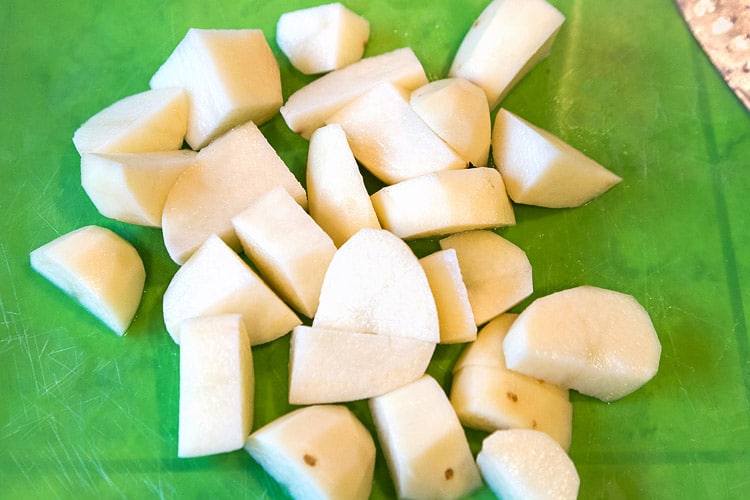 Chop potatoes into chunks.