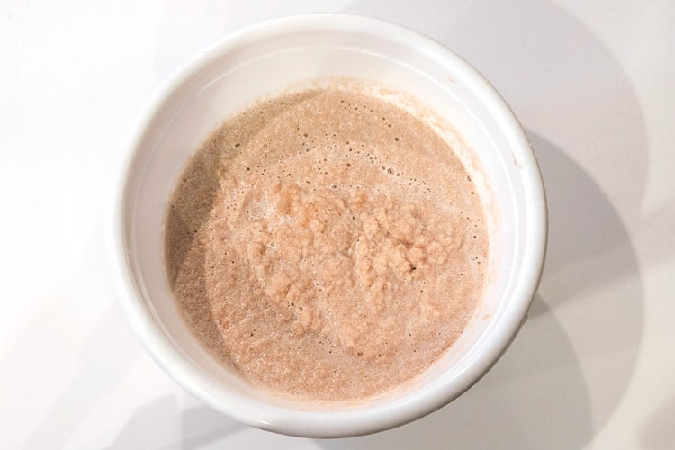Puréed potatoes dumped into a bowl.