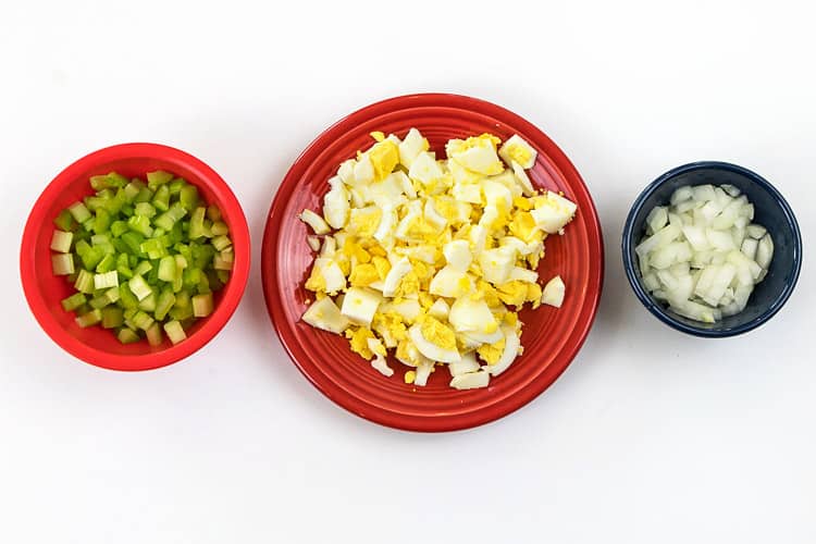 Cut the celery, eggs, and onions.