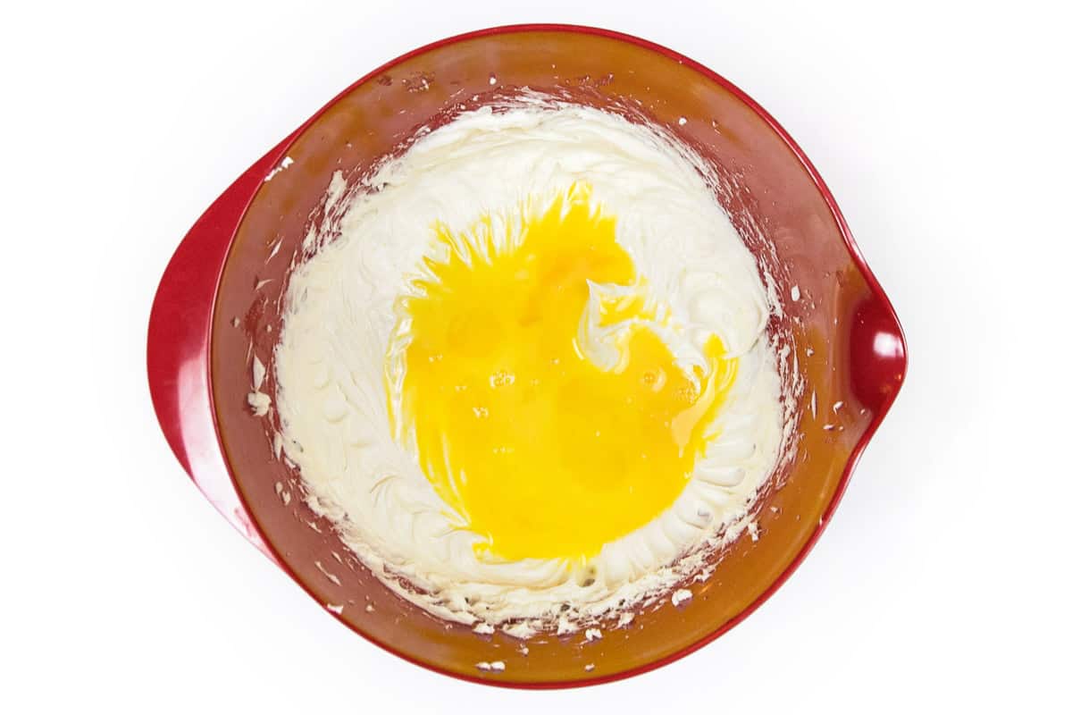 The two eggs are added to the cream cheese mixture.