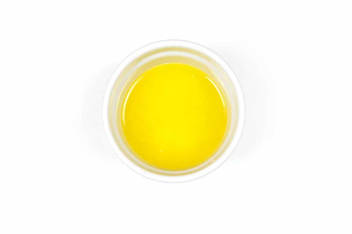 One-fourth cup of melted butter in a bowl.