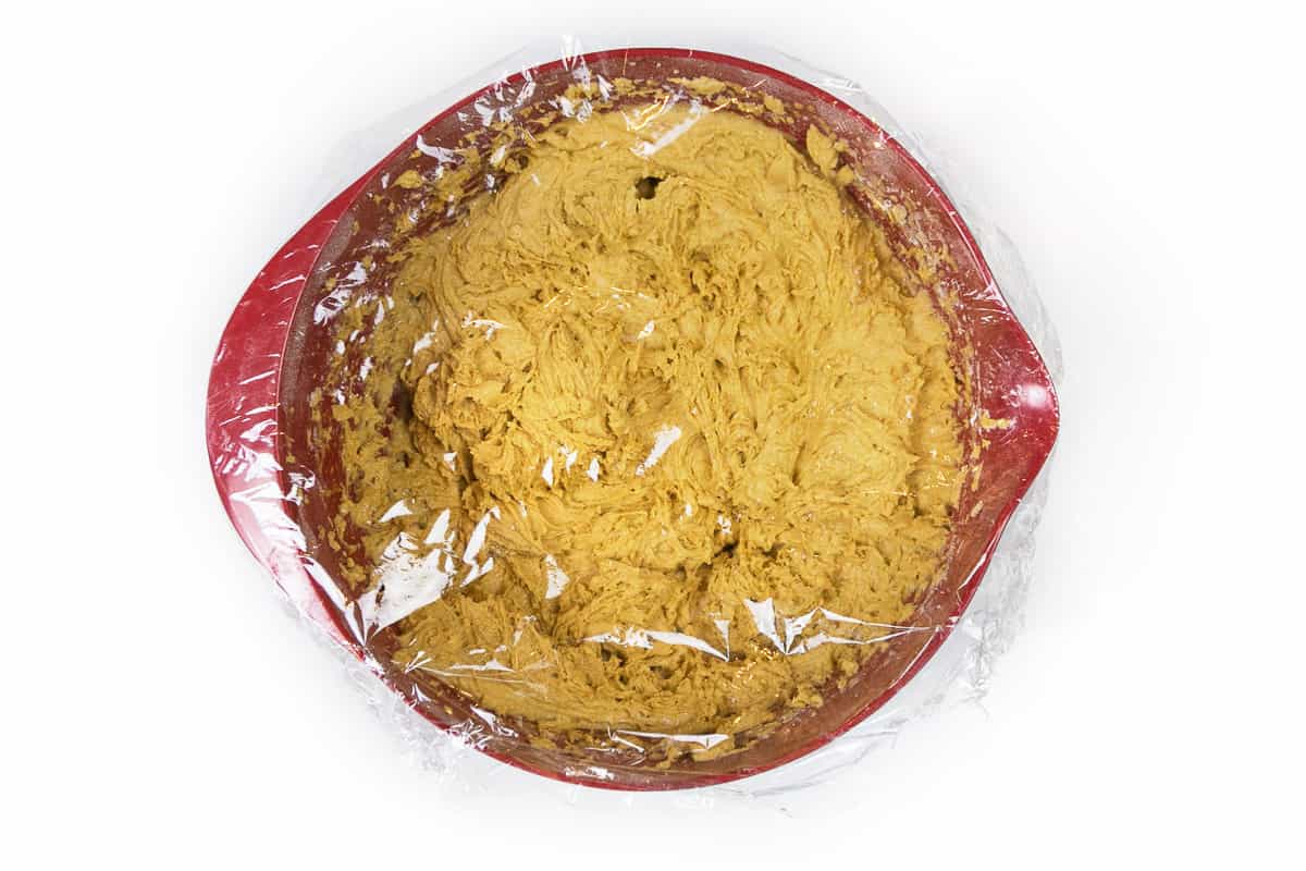 Put some plastic wrap around the bowl of cookie dough and refrigerate it for forty-five minutes to one hour.
