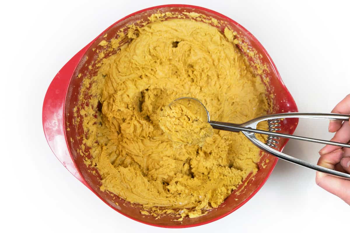 Scoop out some cookie dough with a cookie scooper and make a cookie dough ball.