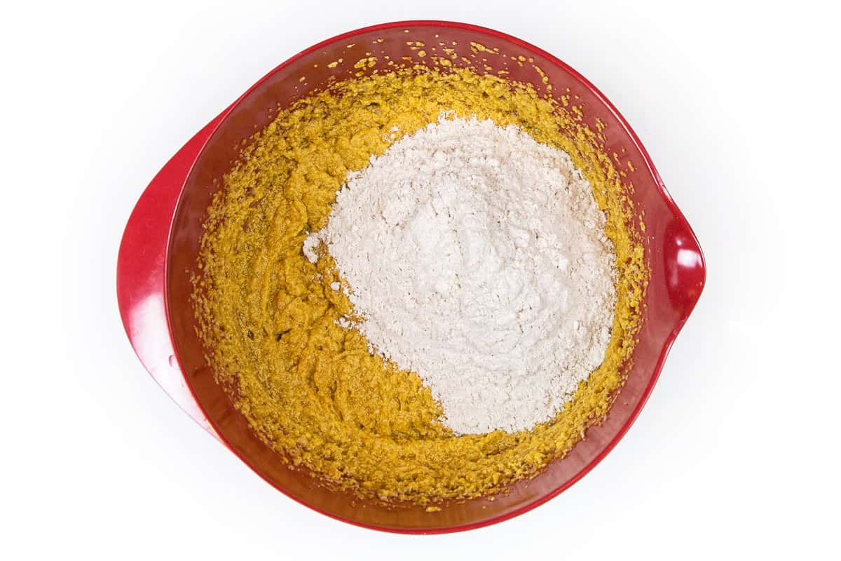 Some of the dry ingredients are added to the wet ingredients.