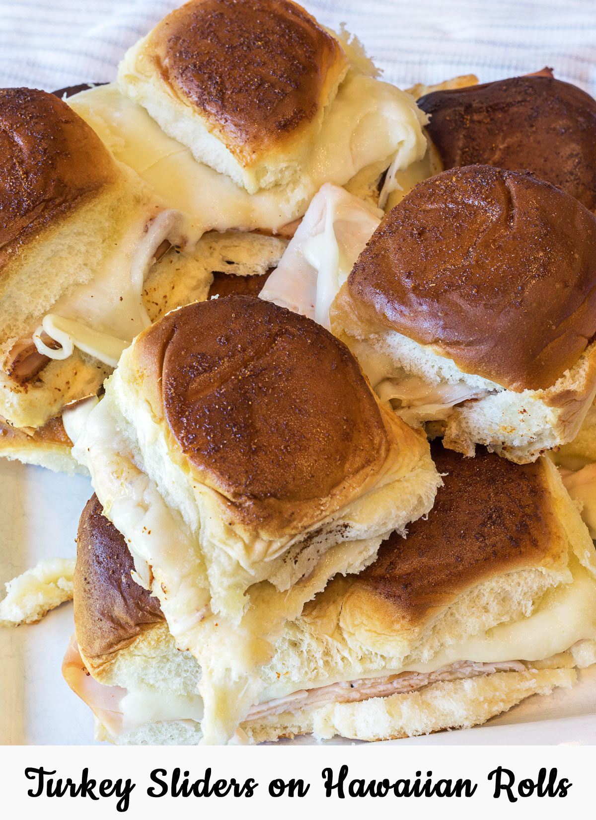 Turkey Sliders on Hawaiian Rolls on a plate.