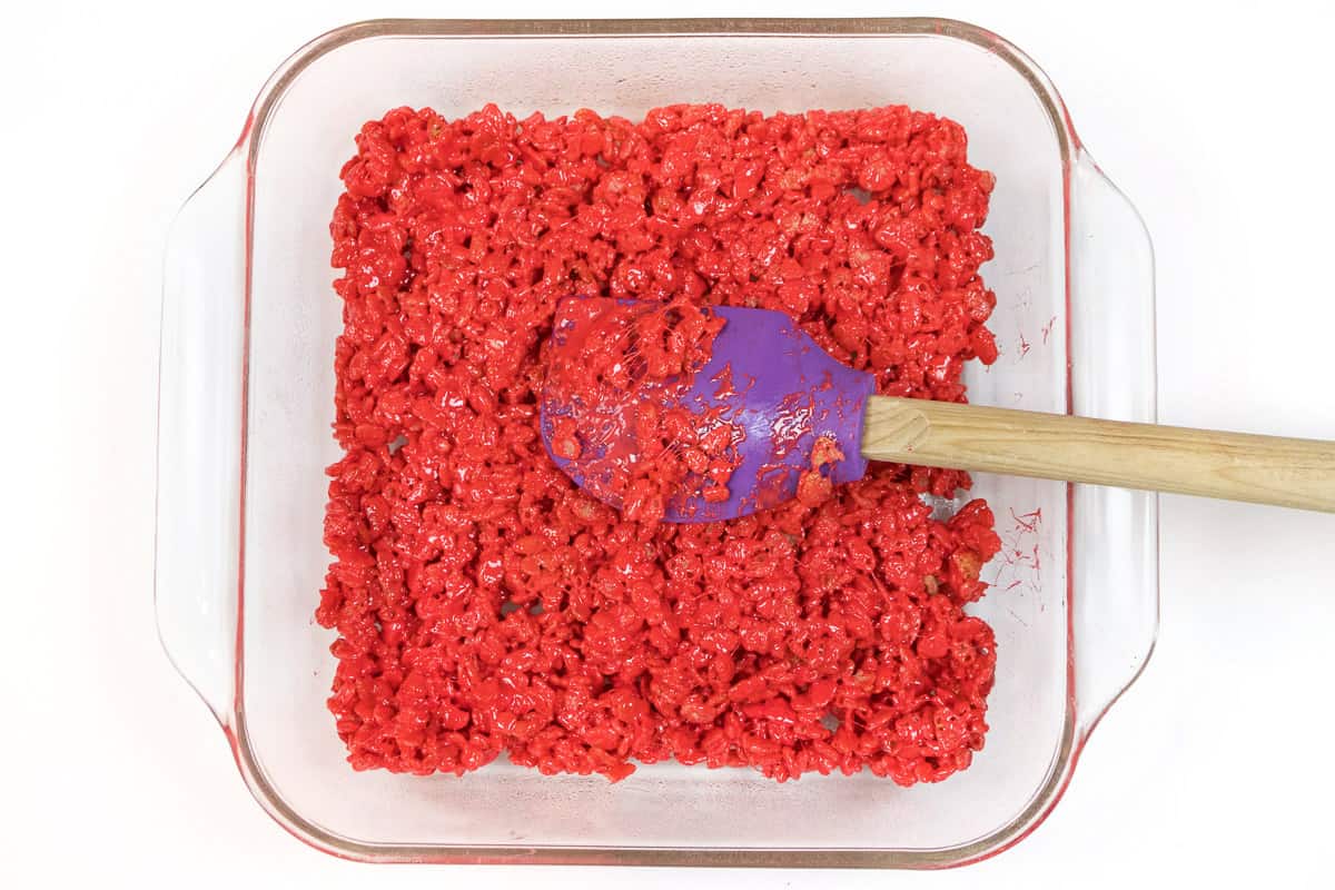 Spread the red mixture into a nine by nine inch baking dish.