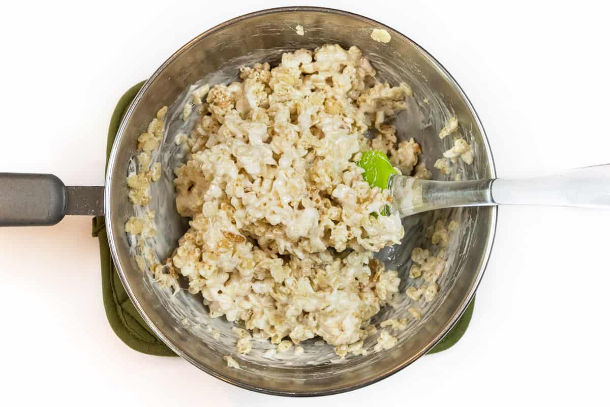 Stir Rice Krispies into the melted marshmallows and butter.