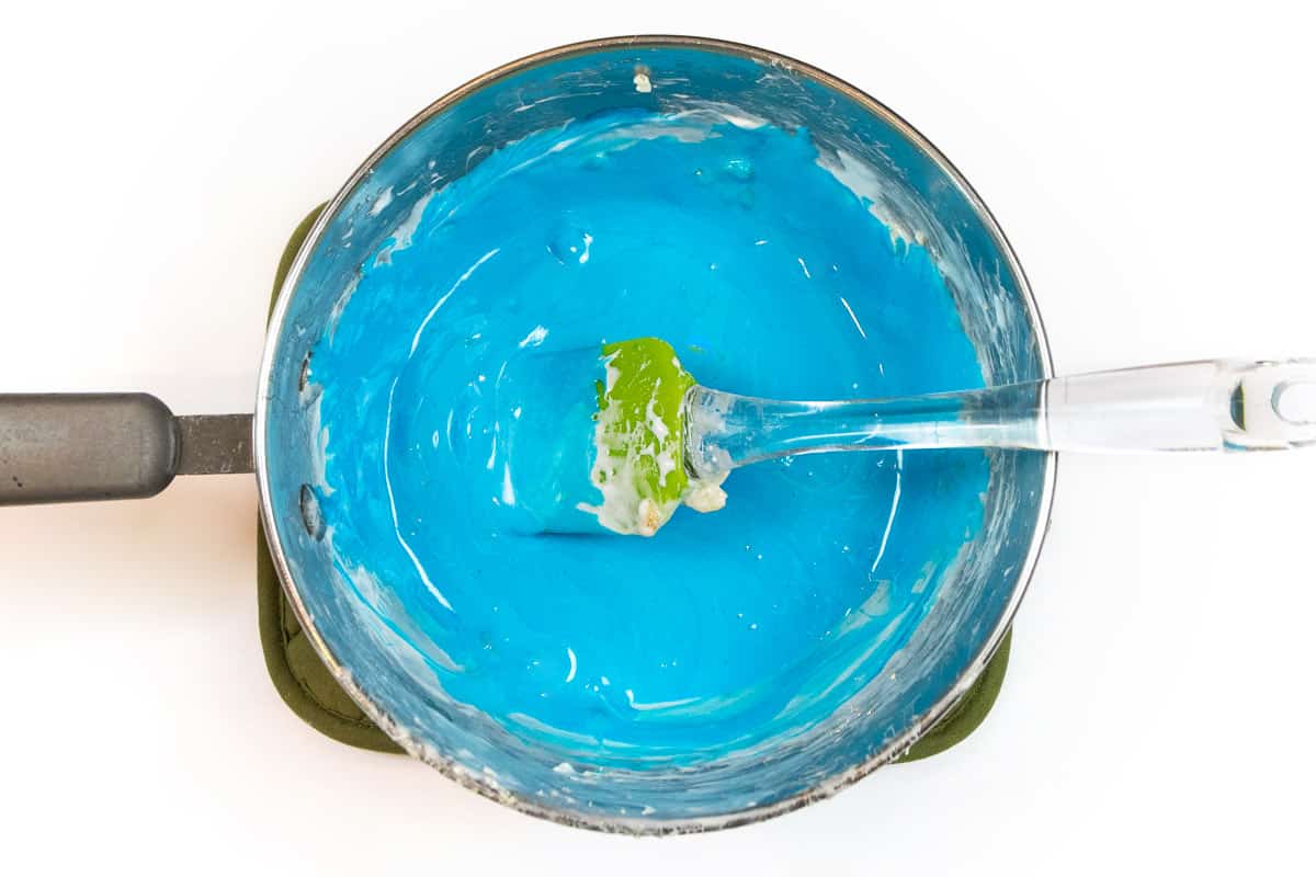 Add the blue food coloring into the melted mixture.