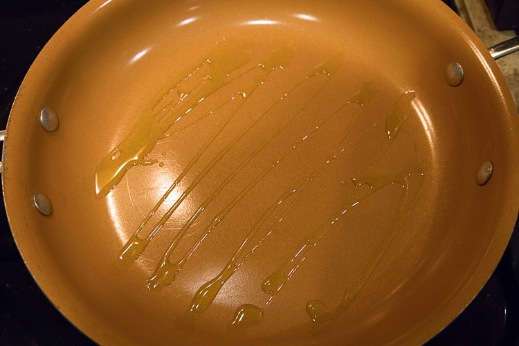 Olive oil in a frying pan.