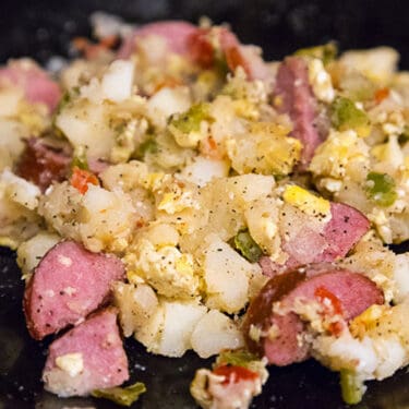 Sausage potato hash on a plate.