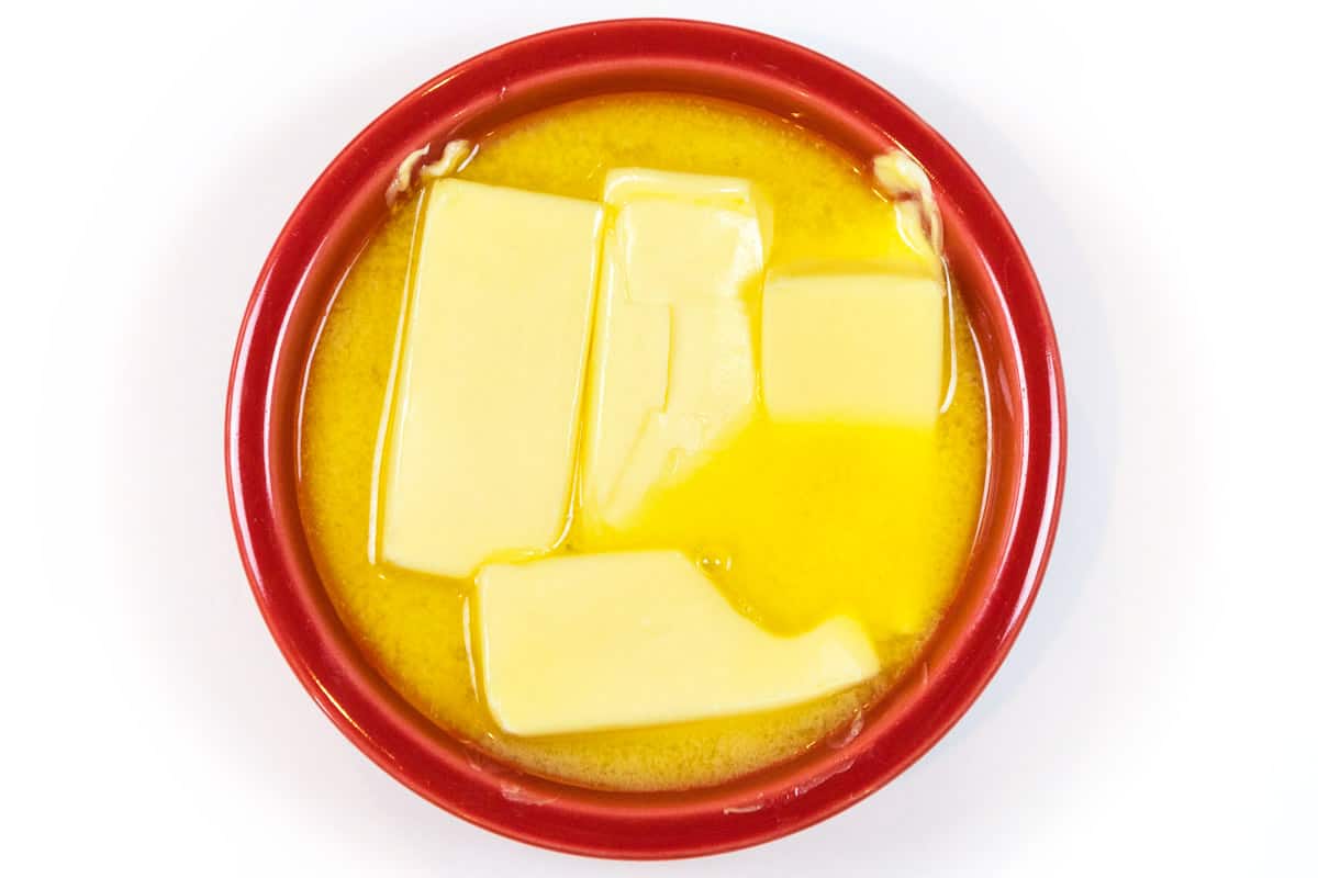 Melt four sticks of butter (two cups) for about one minute in the microwave.
