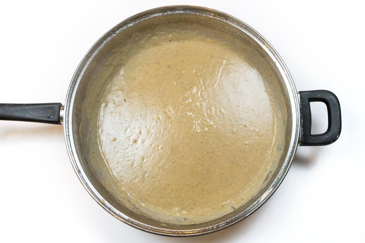 Gravy in a frying pan.