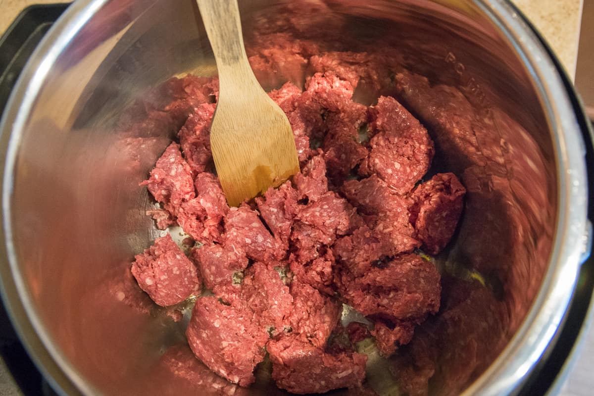 Photo of ground beef sauteing in the instant pot.