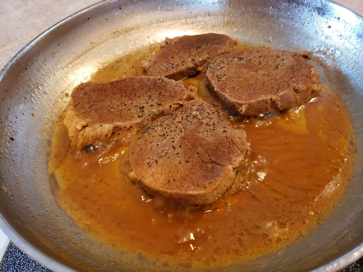Beef eye of round steak done in the frying pan.