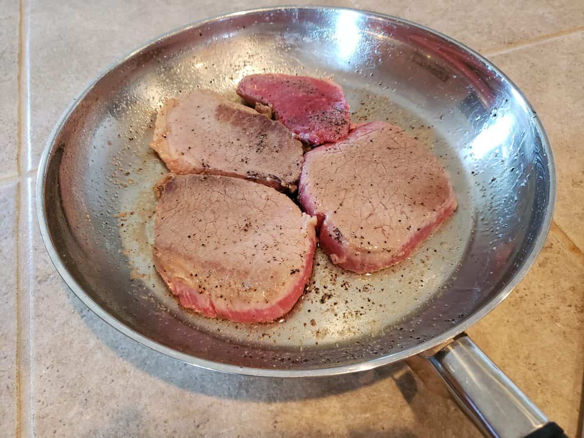 Brown steak in the frying pan on medium-high heat.