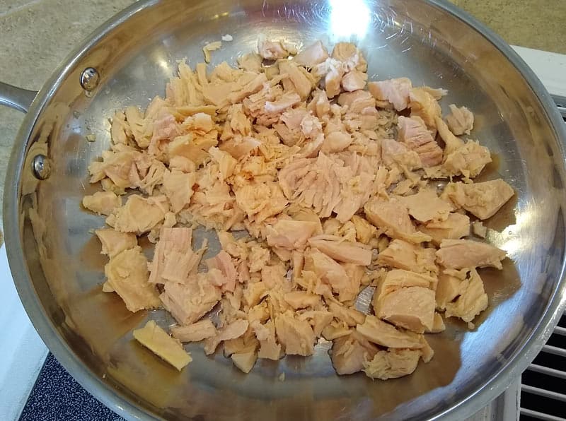 Canned chicken in a frying pan.
