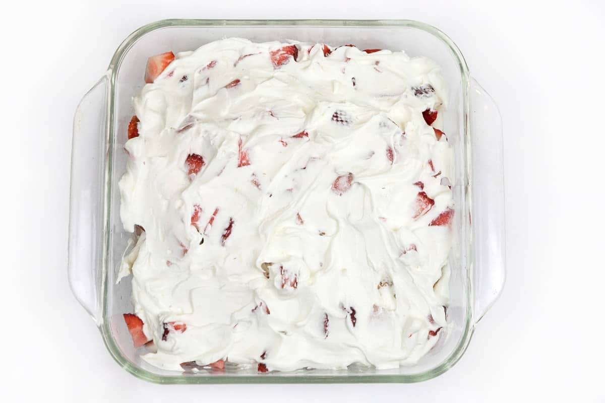 The seventh layer of the cake is the last one-third of the whipped cream.