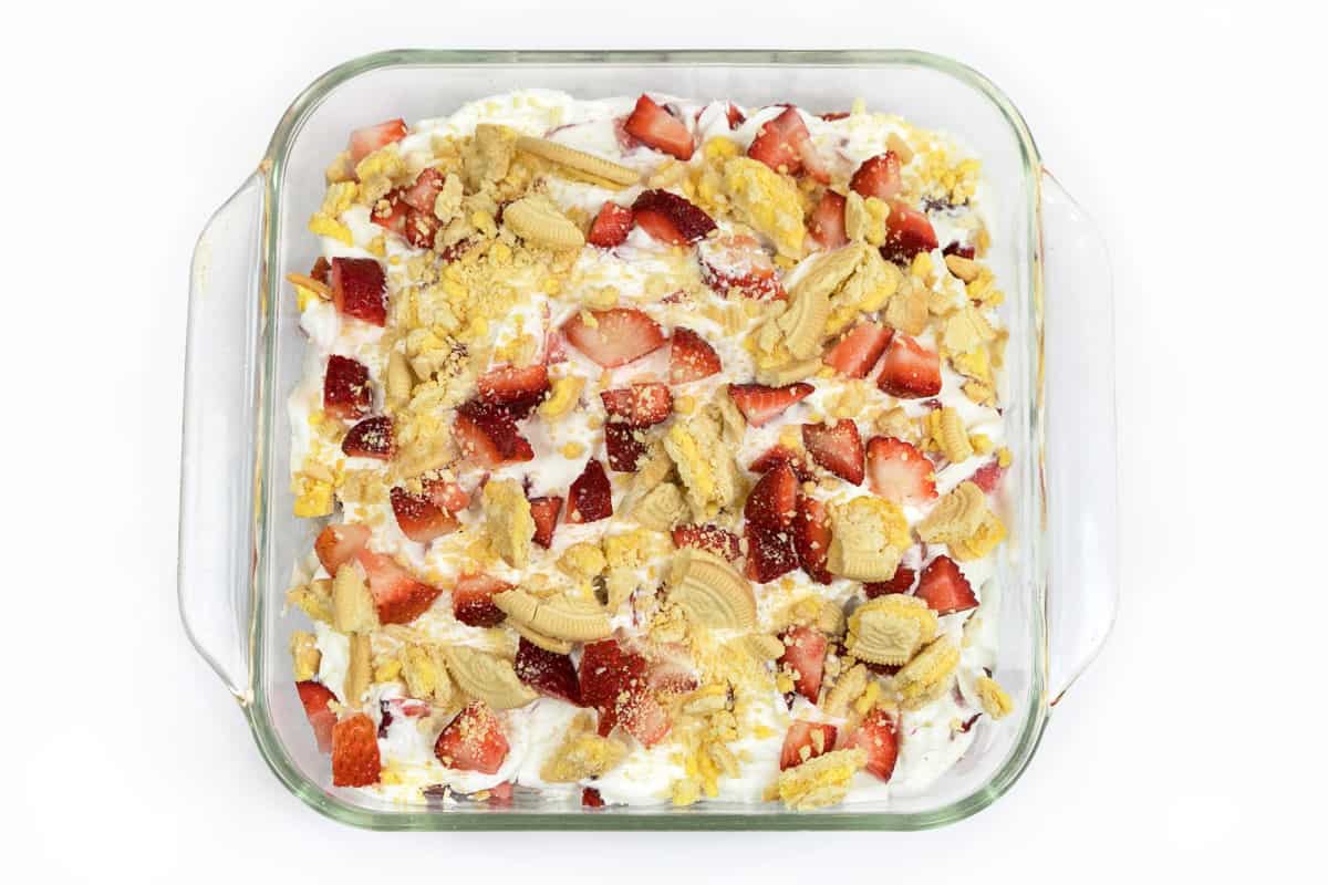 The last layer of the cake is the remaining strawberries and the pieces of lemon creme cookies.