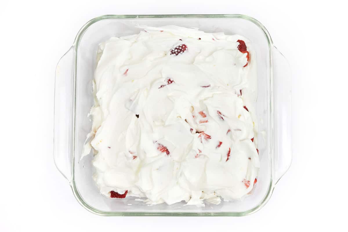The fourth layer of the cake is another one-third of the whipped cream.
