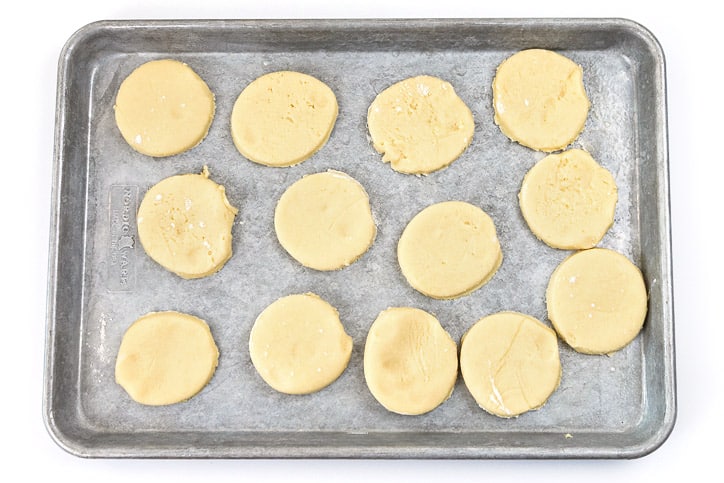 Cookie dough shapes on a cookie sheet.