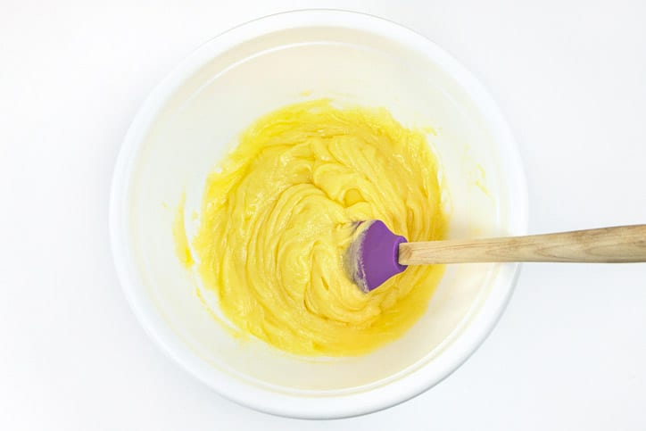 Stir the melted butter, sugar, eggs, milk, and vanilla extract together.