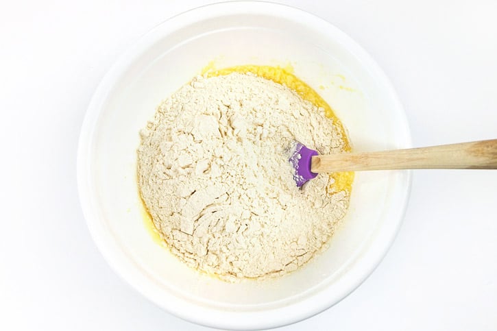 Flour, butter, sugar, eggs, milk, and vanilla extract in a bowl.