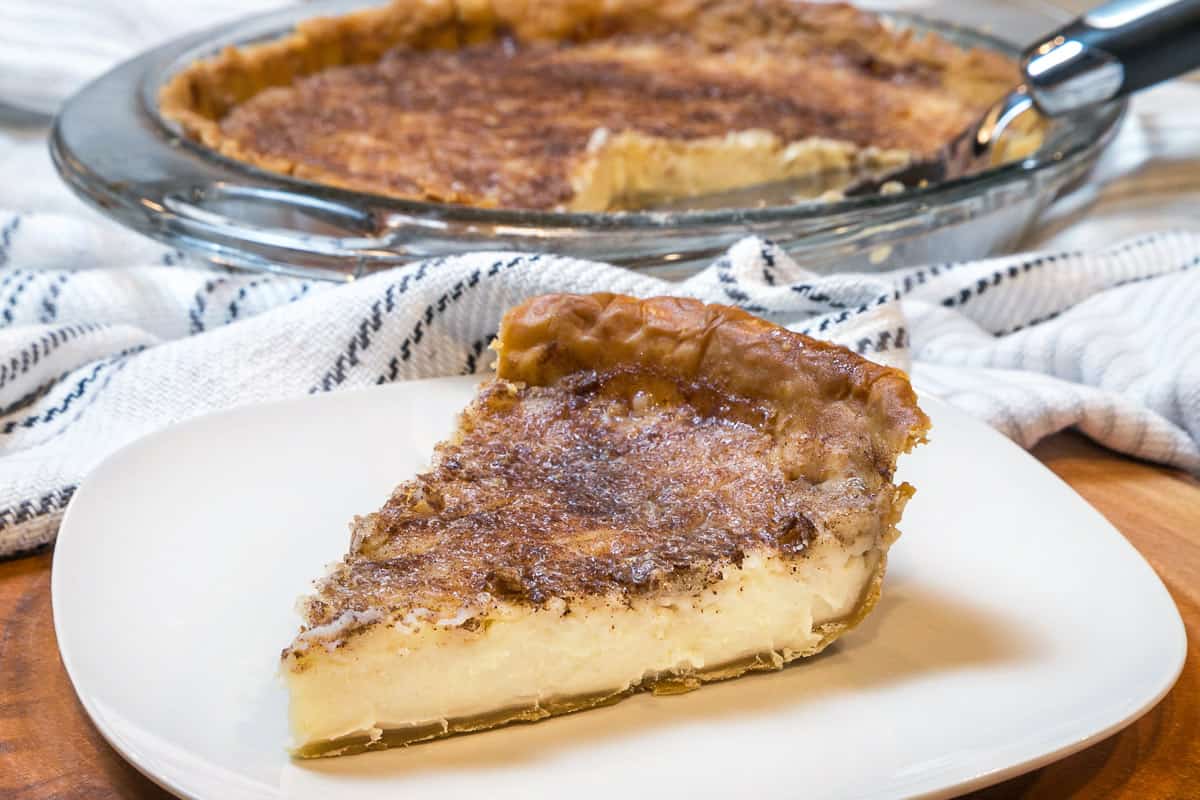 A slice of sugar cream pie on a plate.