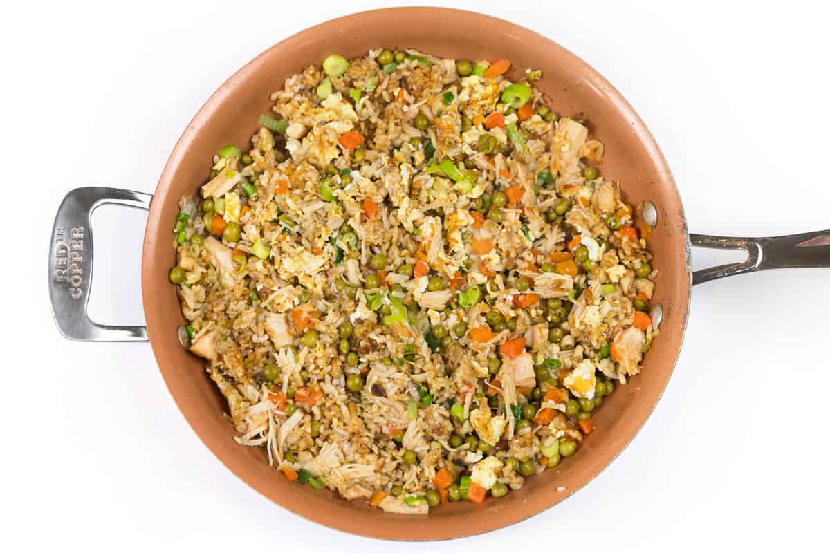 Teriyaki chicken fried rice in a frying pan.