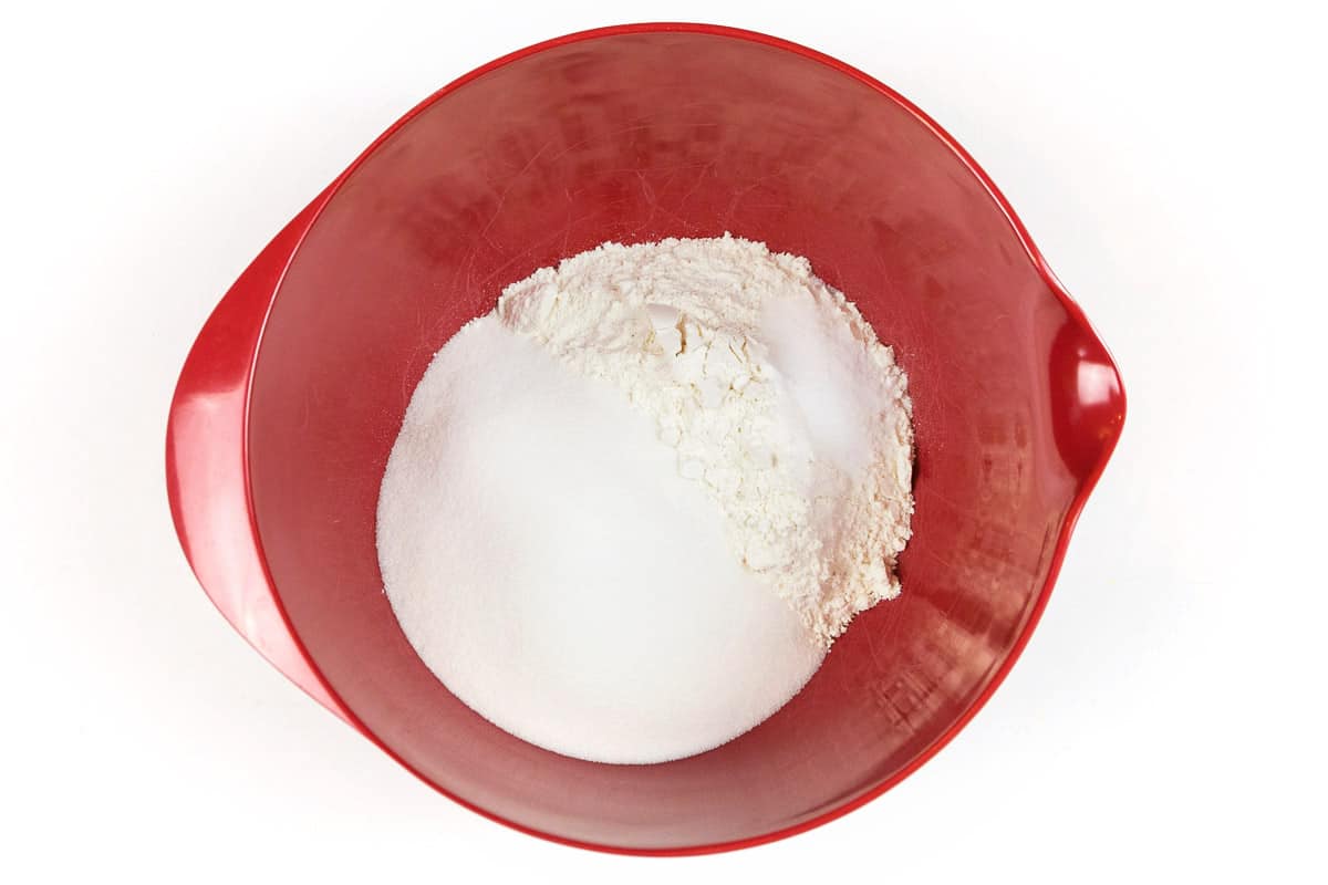Mix in a medium-sized bowl two cups of all-purpose flour, one teaspoon of baking soda, one cup of granulated sugar, and one-half teaspoon of table salt.