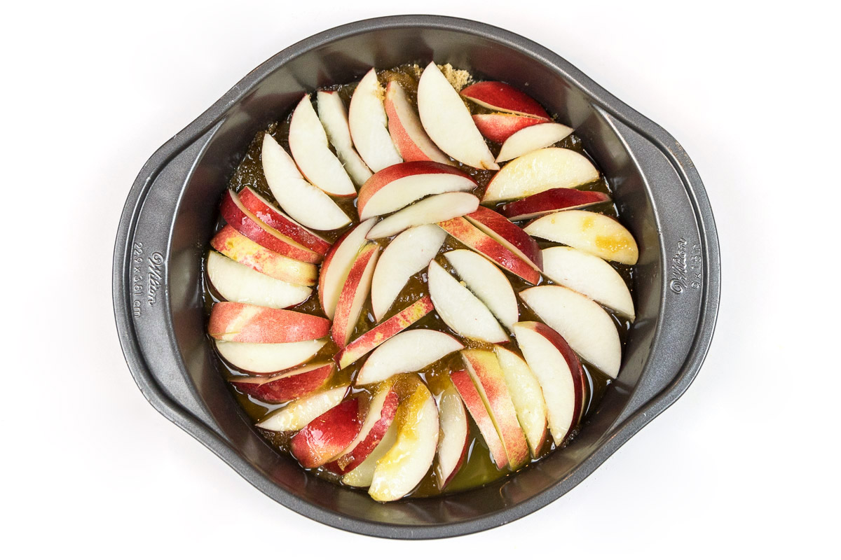 Line the baking dish with the nectarine wedges in a single layer over the top of the melted butter and brown sugar.