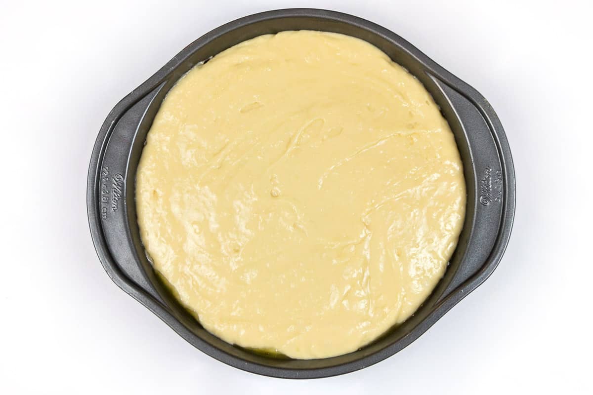 Pour the cake batter into the cake pan over the top of all of the nectarines smoothing out the batter as you pour.