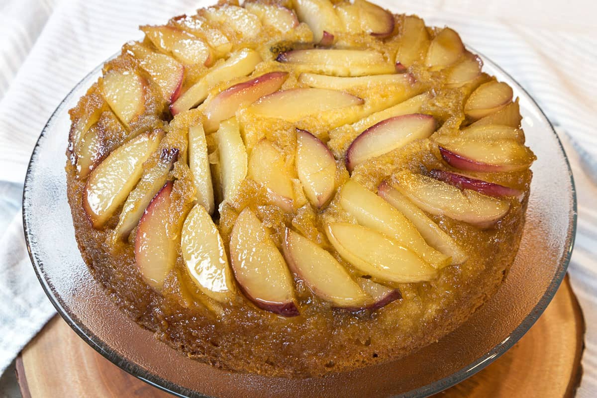White Nectarine Cake (Upside-Down) on a cake stand.